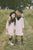 Jouet Cream Dress With Black V Detail